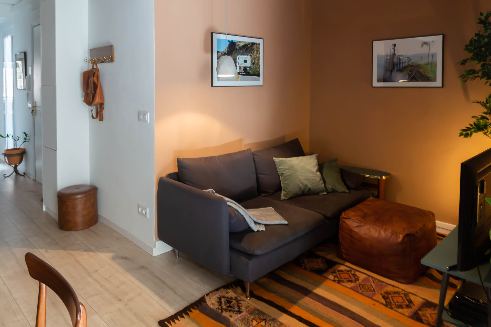 Barcelona Home tour: sitting room with vintage Moroccan rug and puff