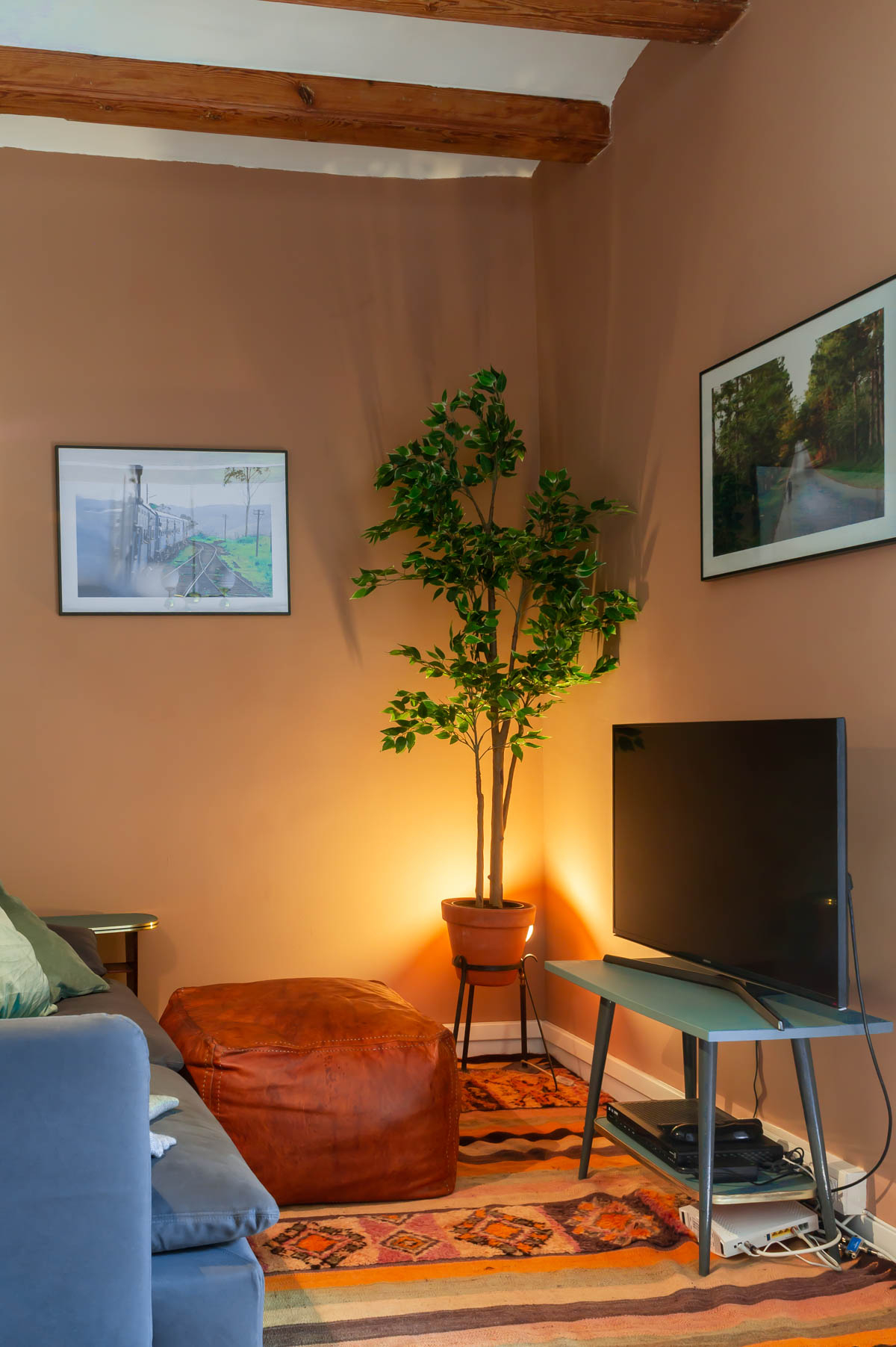 Barcelona Home tour: sitting room with vintage Moroccan rug and puff