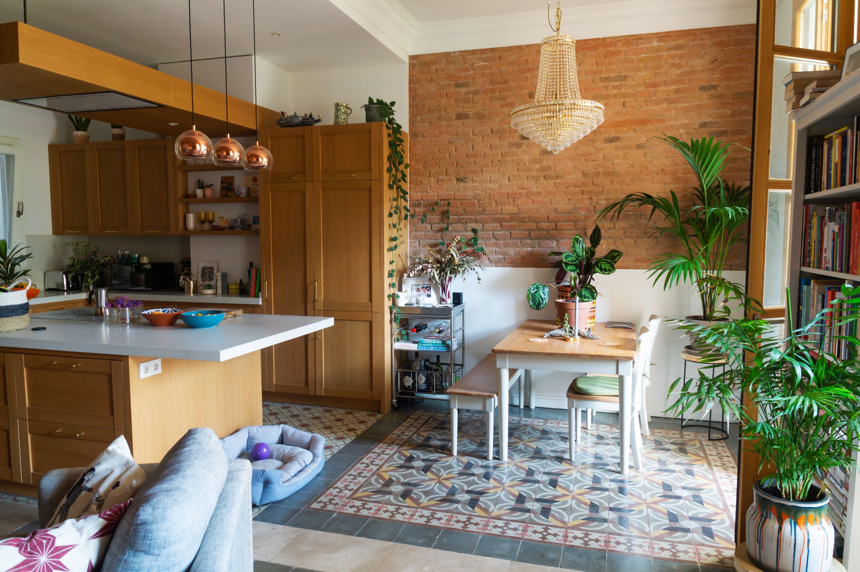 Gemma home tour Barcelona open space with kitchen and dining table with tile floor