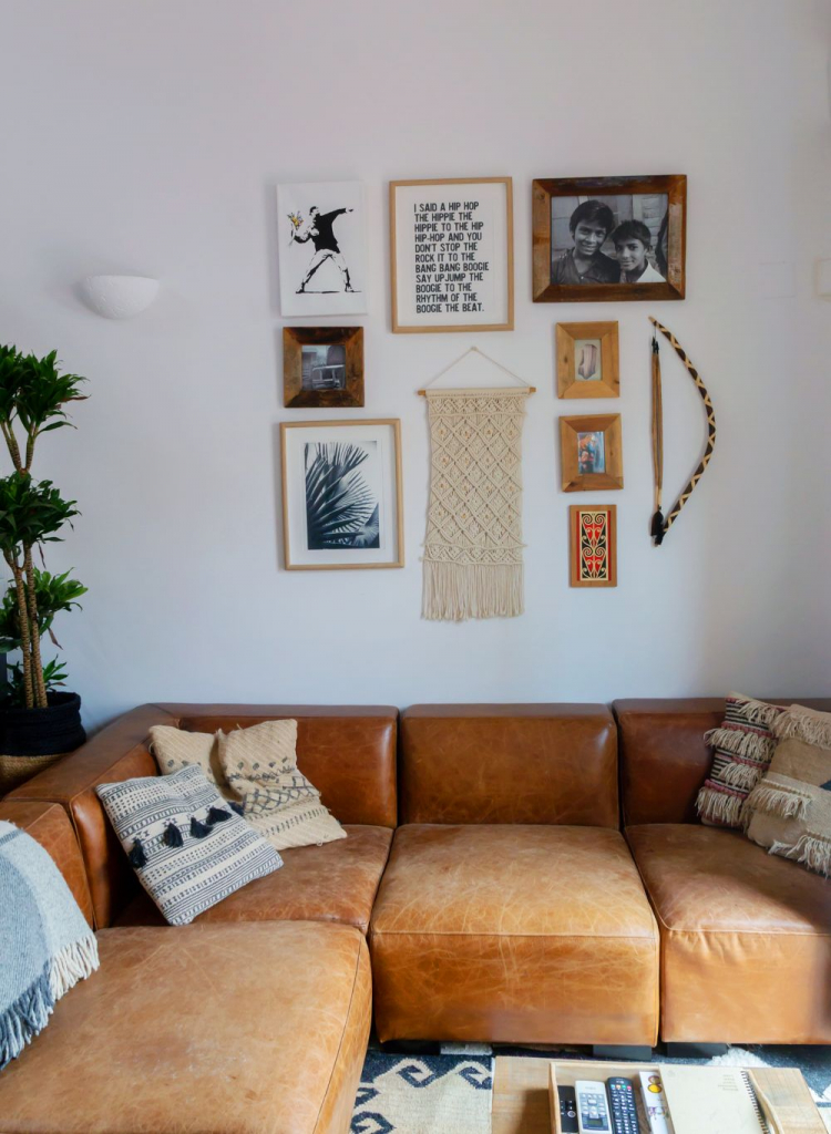 Gallery wall in neutral-colored living room, Barcelona home tour