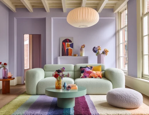 Eclectic dopamine living room with lilac wall and mint green sofa